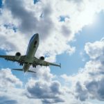 low-angle photography of airliner during flight