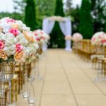 selective focus photography white and pink isle flower arrangement